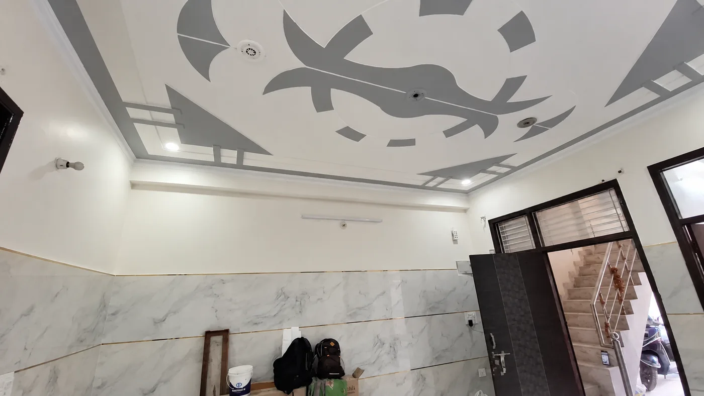 White and grey decorative false ceiling completed by HouseShine